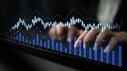 Naklejka premium A close-up of hands typing on a keyboard, surrounded by digital graphs and charts, representing data analysis and financial trends in a modern workspace. Scalp