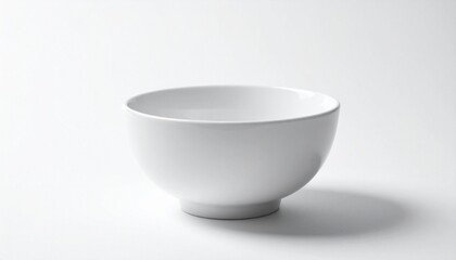 Glossy white ceramic bowl centered on white surface