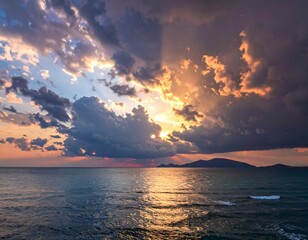 Dramatic sunset over ocean with dark clouds and sun rays breaking through the clouds