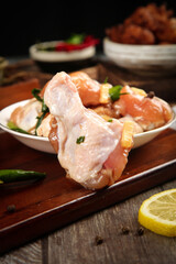 Raw Chicken Thighs with Fresh Lemon and Herbs