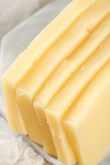 Fresh Sliced German Block Cheese with Holes Close-Up
