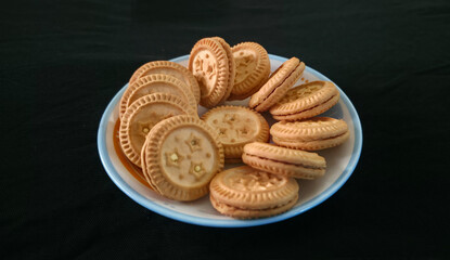 Light, crisp sandwich biscuits filled with a smooth, sweet cream center, offering a perfect balance of crunch and flavor in every bite.