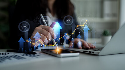 A business professional actively analyzing growth data using graphs and charts, showcasing a focus on performance metrics and strategic planning in a modern office environment. Scalp