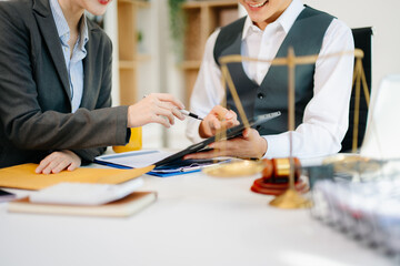 Business and lawyers discussing contract papers with brass scale on desk in office. Law, legal...