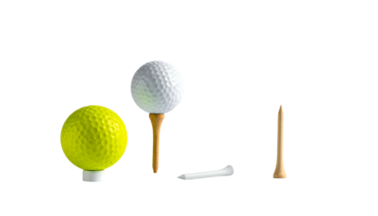 Golf balls and tees a white ball on a tee, a yellow ball, and two other tees