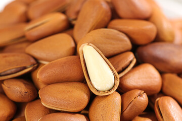Handpeeled Pine Nuts from Northeastern Region - Large Edible Seeds with Split Shell Showing White Kernel