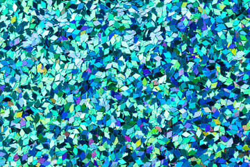Superlative holographic glitter background, your texture with sparkles in blue tones.