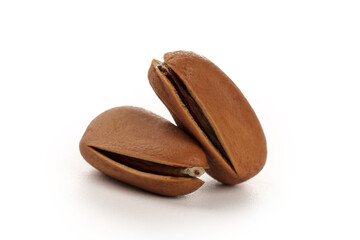 Hand-Peeled Pine Nuts with Red Brown Shells Cracked Open on White Background