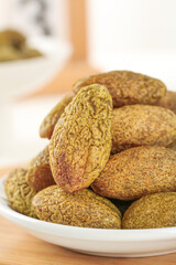 Fresh Walnuts in Shells in White Bowl on Wood Table - Healthy Natural Nuts Snack Food