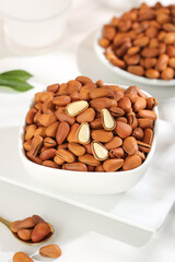 Handpeeled Pine Nuts in White Bowls - Fresh Natural Food Ingredient