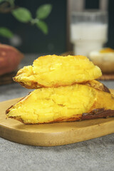 Golden Roasted Sweet Potato Halves on Wooden Cutting Board - Healthy Comfort Food Ingredient