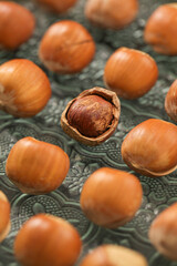 Hand-peeled hazelnuts with kernels and open shells - fresh dried nuts and natural fruits