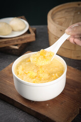 Sweet Yellow Millet Porridge Healthy Breakfast with Steamed Buns and Bamboo Steamer