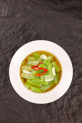 Stir-Fried Squash with Garlic and Chili - Asian Vegetable Dish on Dark Slate Background
