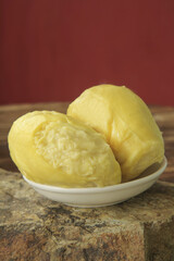 Fresh Golden Durian Fruit Segments in Bowl - Thai Tropical Delicacy with Creamy Texture