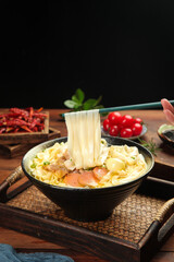 Handrolled Beef Noodle Soup with Chopsticks in Traditional Black Bowl - Asian Cuisine