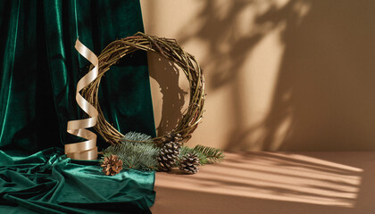 Elegant Holiday Scene with Rustic Wreath and Gold Ribbon on Emerald Velvet Fabric, Perfect for Festive Greetings and Cozy Winter Designs