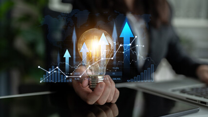 Captivating business innovation image featuring a light bulb, rising graphs, and data visualization, symbolizing growth, creativity, and strategic planning in a corporate setting. Scalp