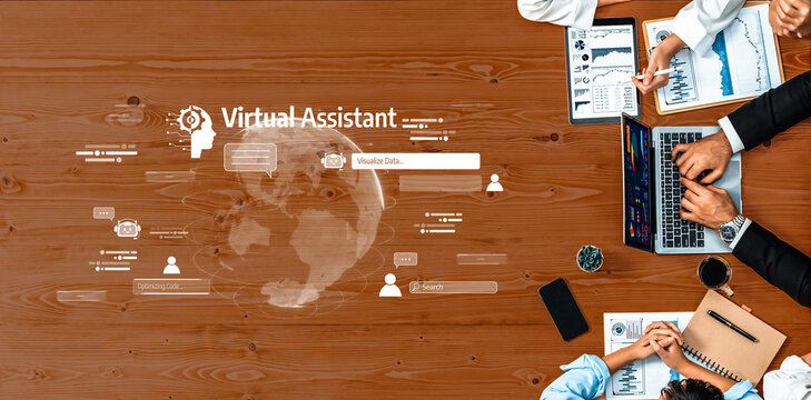 A diverse group of professionals collaborates at a wooden desk, utilizing a laptop and innovative virtual assistant technology for effective communication and data analysis. Trope - Powered by Adobe