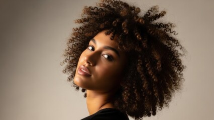 Beautiful young woman with natural curly hair portrait