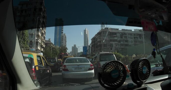 Mumbai, India. Traffic in center street. Cars Moving On Street In day. POV inside car
