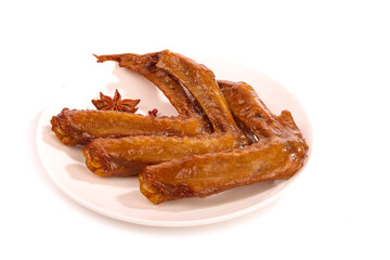 Spicy Marinated Baked Duck Wings with Star Anise on White Plate