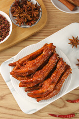 Marinated Chicken Feet with Star Anise Sauce Asian Traditional Snack Food on Wooden Background