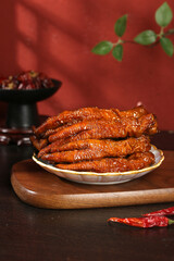 Marinated Chicken Feet in Secret Sauce - Traditional Asian Snack Delicacy with Crispy Golden Skin