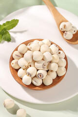 Dried White Lotus Seeds in Wooden Bowl - Pure Natural Ingredients for Healthy Cooking and Traditional Medicine