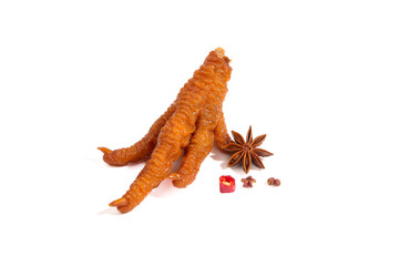 Golden Crispy Chicken Feet with Star Anise Spices Traditional Asian Snack Food on White Background