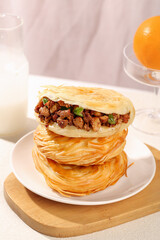Chinese Tongguan Roujiamo Meat Bun Sandwich Traditional Shaanxi Breakfast with Milk and Orange