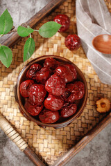 Xinjiang Red Jujube Dates in Wooden Bowl - Traditional Chinese Dried Fruit Snack on Bamboo Tray with Natural Styling