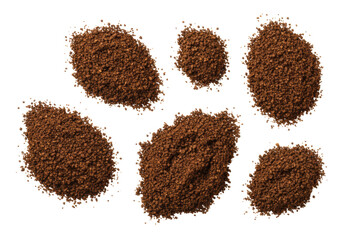Macro flat lay of dark brown granular piles, resembling ground coffee or black pepper, varying in size, on a transparent background with copy space, bright studio lighting. Culinary texture concept