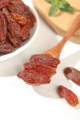Red Xinjiang Raisins on Wooden Spoon - Sweet Dried Fruit Snack Food Photography
