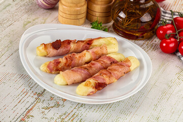 Hot mozzarella sticks with bacon