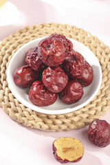 Dried Red Jujube Dates from Xinjiang China in Bowl - Traditional Healthy Winter Superfood Snack