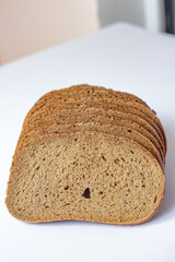 Lifestyle Vertical Shot of Fresh Bread Slices with Soft Domestic Background.
