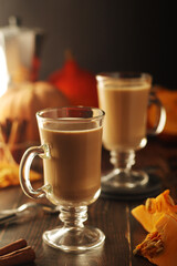 Glasses with warm pumpkin latte	