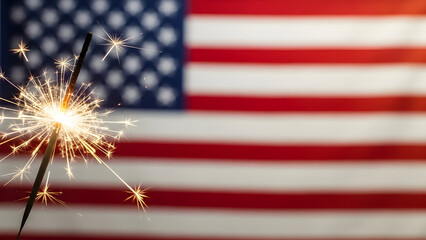 Sparkling sparkler against an american flag for fourth of july celebration