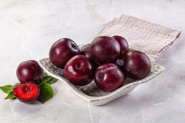 Raw ripe purple plum heap
