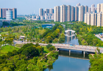 Wuhan Donghu Lake Ecological Park with Modern Bridge and Urban Skyline © PhamHong