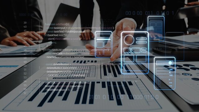 A business team collaborates on data analysis, utilizing technology and digital tools on tablets and screens to drive effective decision-making and enhance productivity. Raster