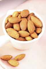 Tasty Almonds and Healthy Nuts in White Bowl