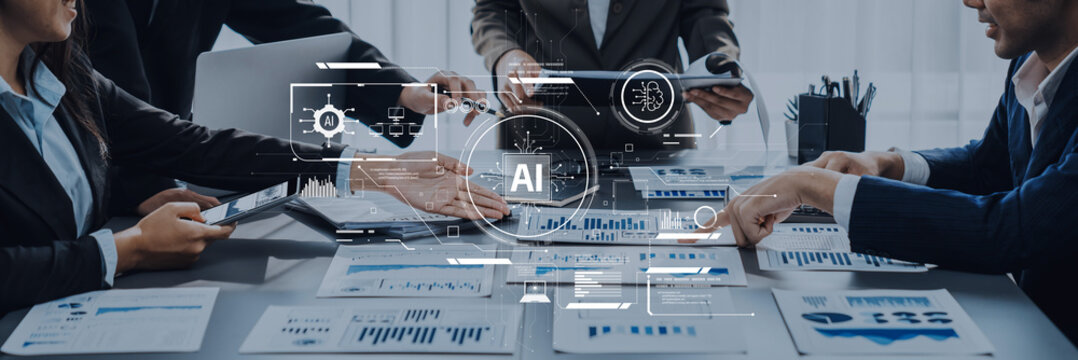 A diverse team engages in a collaborative discussion in a modern office setting, utilizing AI technology to analyze data for business growth strategies. Trope - Powered by Adobe