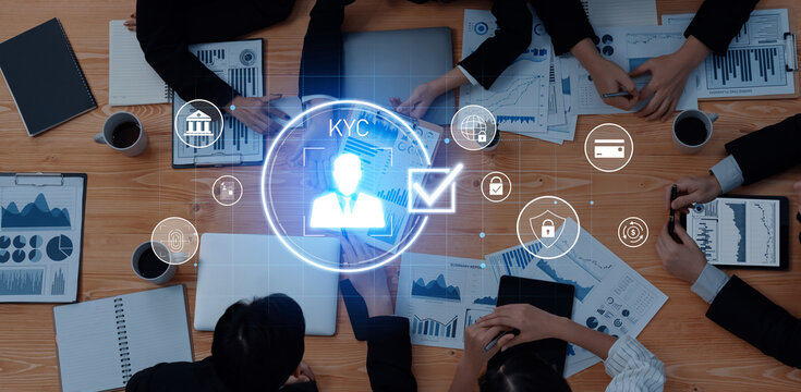 A professional business meeting focused on KYC procedures, showcasing teamwork, technology, and data analysis in a modern office environment. Trope