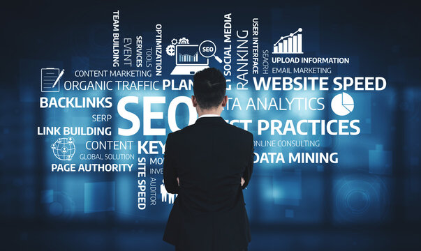 A business professional observes various digital marketing strategies related to SEO and analytics. The image highlights essential keywords and concepts for online success. Tessel