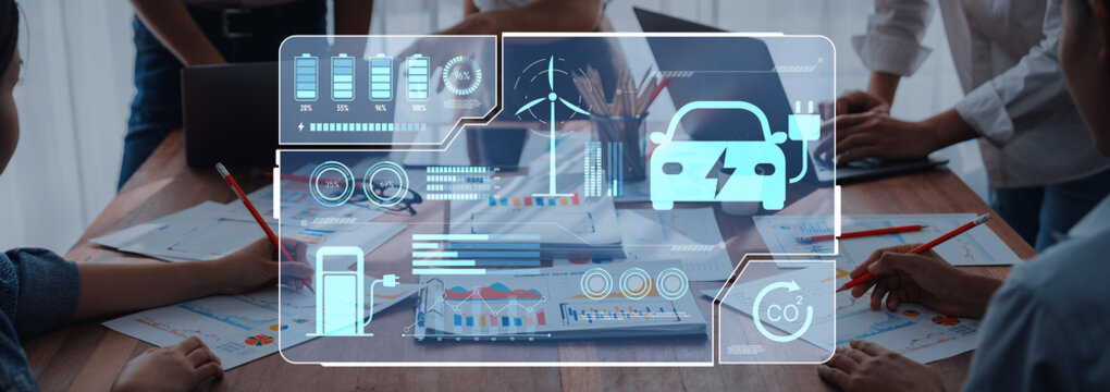 A corporate meeting showcasing teamwork and innovation around electric vehicle technology and renewable energy, featuring data analytics and modern visualization techniques. Trope