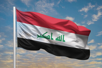 Realistic close-up of the Iraq flag waving on a tall flagpole under a bright sky with soft scattered clouds, showing smooth wind motion, vivid colors, and a clear, proud national atmosphere.

