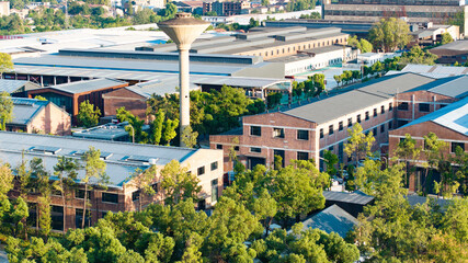 Industrial Park Aerial View with Brick Warehouses and Blue Roofs