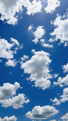 Naklejka premium Clear Blue Sky with Fluffy White Clouds